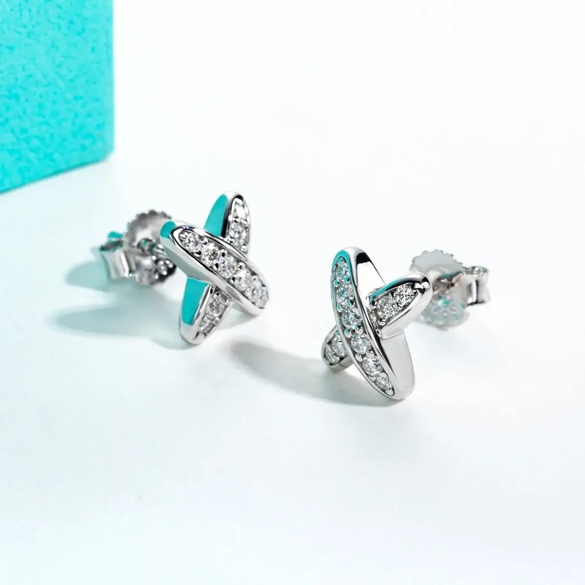 Moissanite diamond cross stud earrings in 925 sterling silver, designed for women, displaying classic elegance.